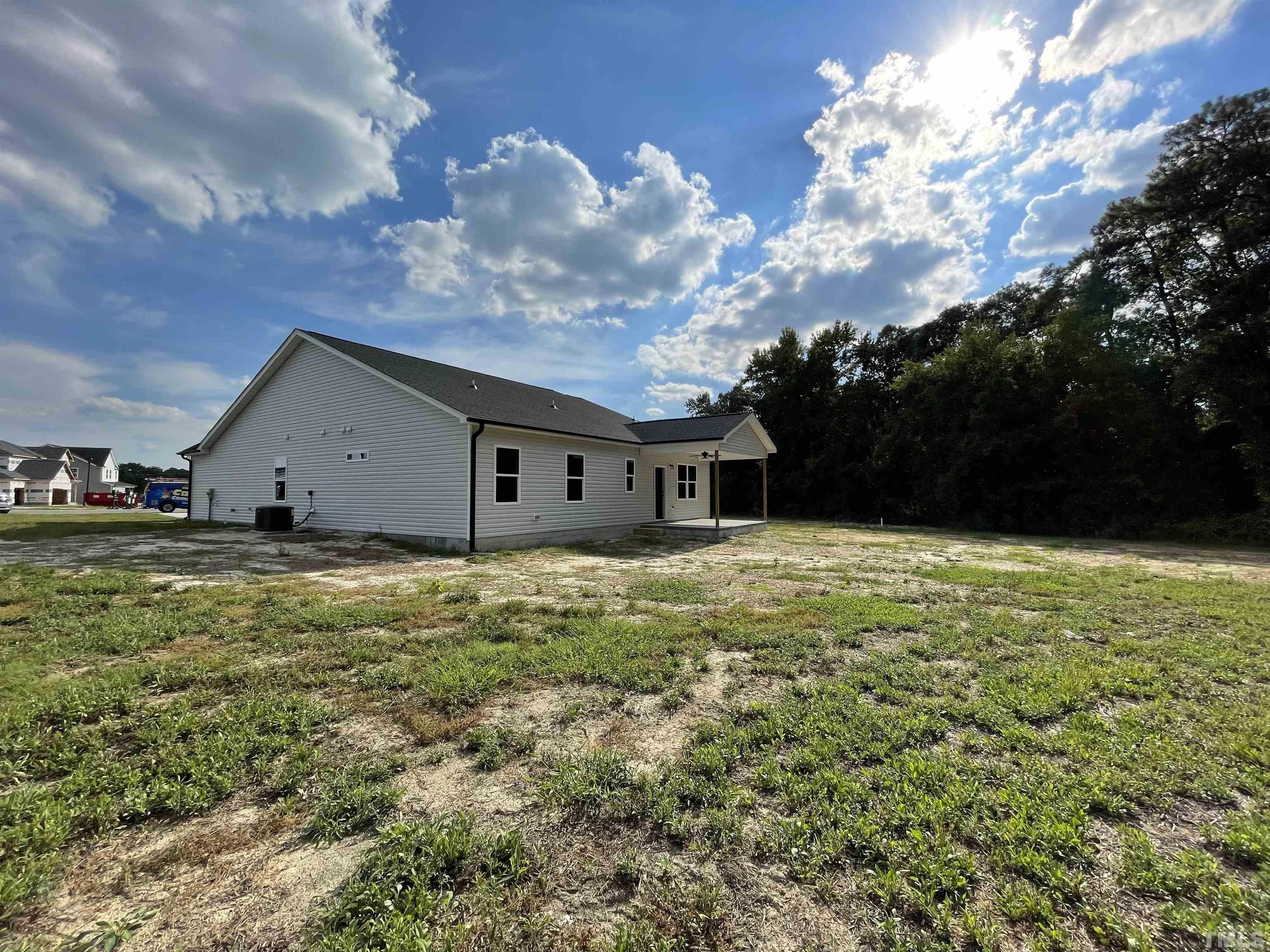 145 Wolf Ridge Willow Spring, NC 27592 - Photo 14 of 17 a view of a house with a yard