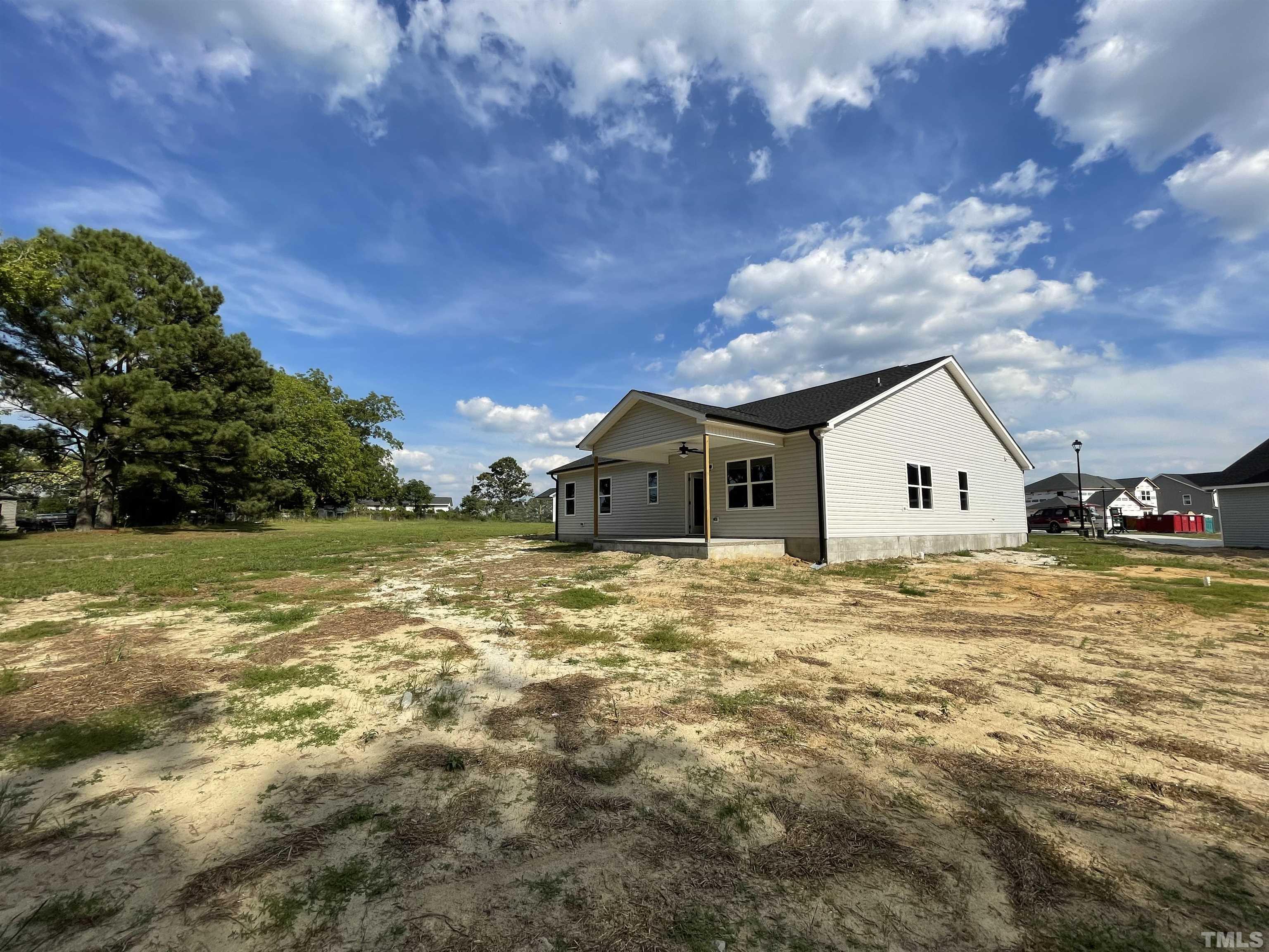 145 Wolf Ridge Willow Spring, NC 27592 - Photo 15 of 17 a view of a house with a yard