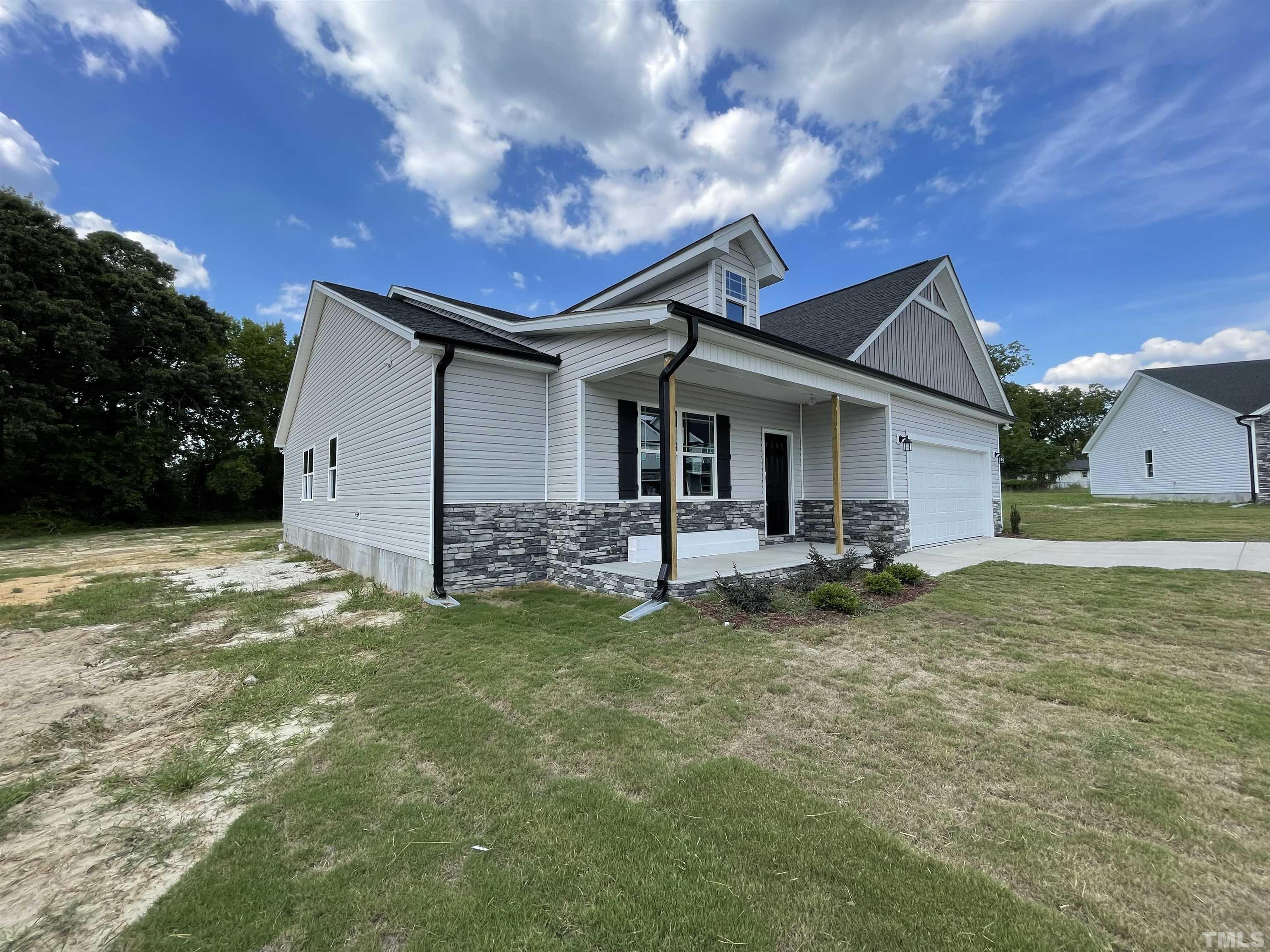 145 Wolf Ridge Willow Spring, NC 27592 - Photo 5 of 17 a view of a house with a yard