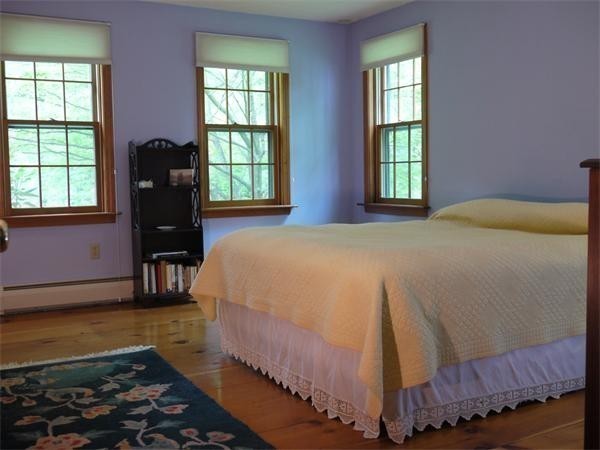38 Mason Road Holden, MA 01522 - Photo 12 of 24 a bed sitting in a bedroom next to a window