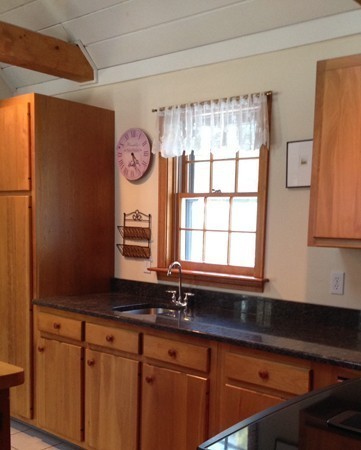 38 Mason Road Holden, MA 01522 - Photo 3 of 24 a kitchen with granite countertop a sink and a window