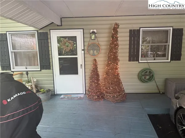 a front view of a house with lots of green space