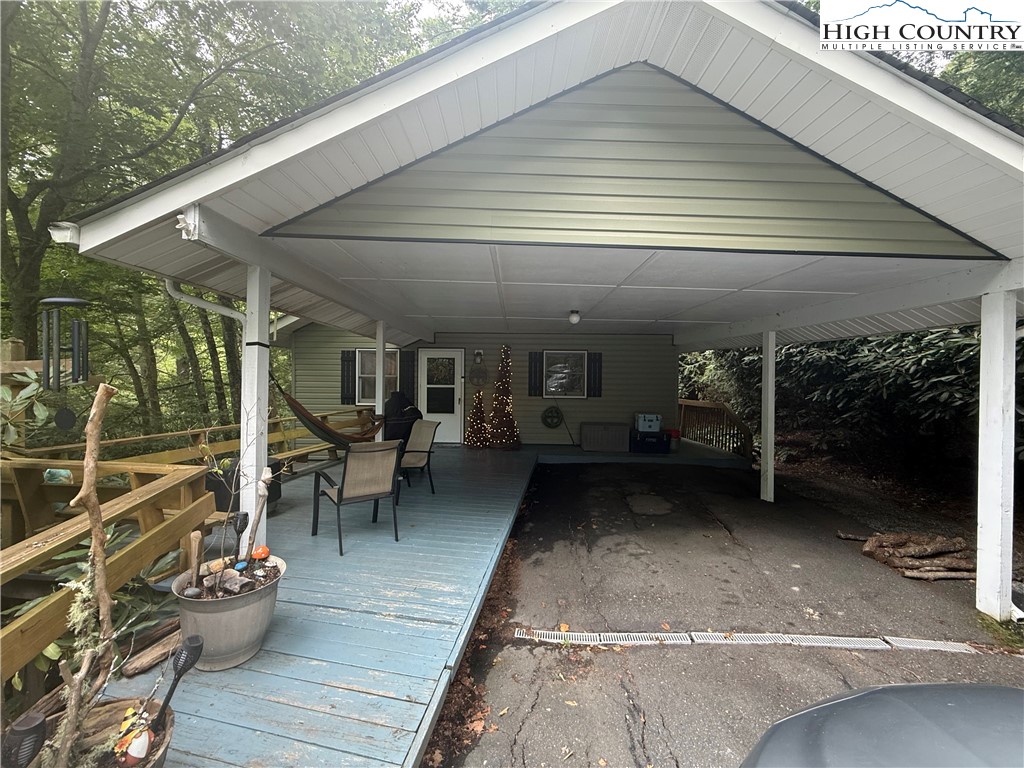 61 River Loop Newland, NC 28657 - Photo 2 of 38 a view of a patio with table and chairs and potted plants
