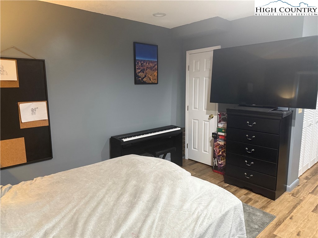 61 River Loop Newland, NC 28657 - Photo 25 of 38 a bedroom with a bed and a dresser
