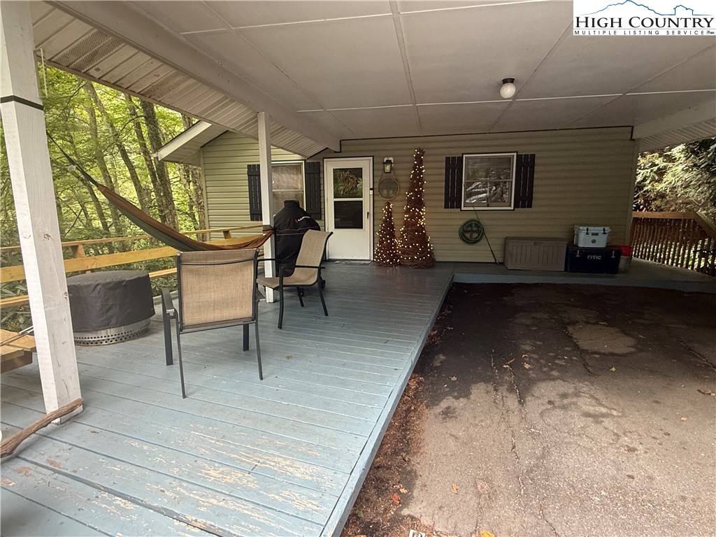 61 River Loop Newland, NC 28657 - Photo 34 of 38 a view of a porch with furniture and a yard