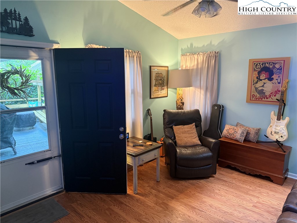 61 River Loop Newland, NC 28657 - Photo 7 of 38 a living room with furniture and a window