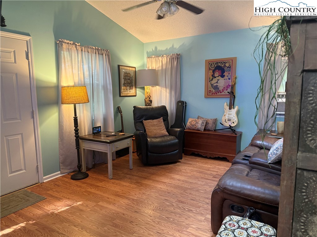 61 River Loop Newland, NC 28657 - Photo 8 of 38 a living room with furniture rug and a window