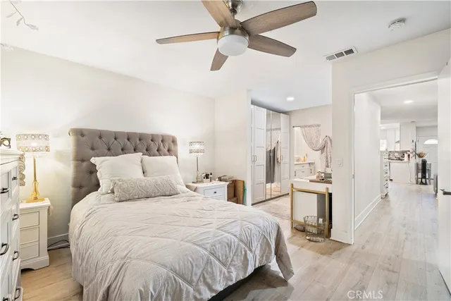 a bedroom with a bed and a view of bathroom