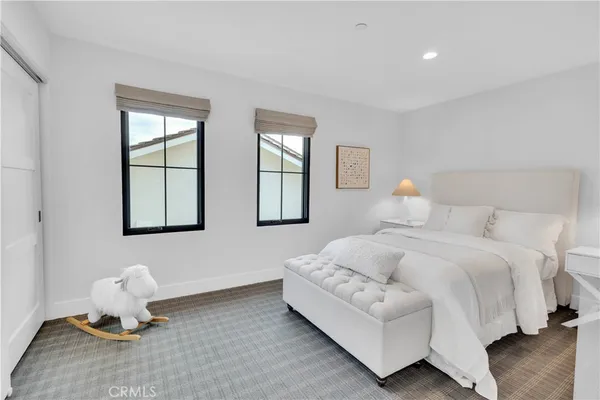 a bedroom with bed and window
