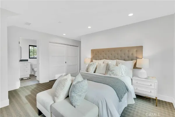 a bed room with a bed and a couch