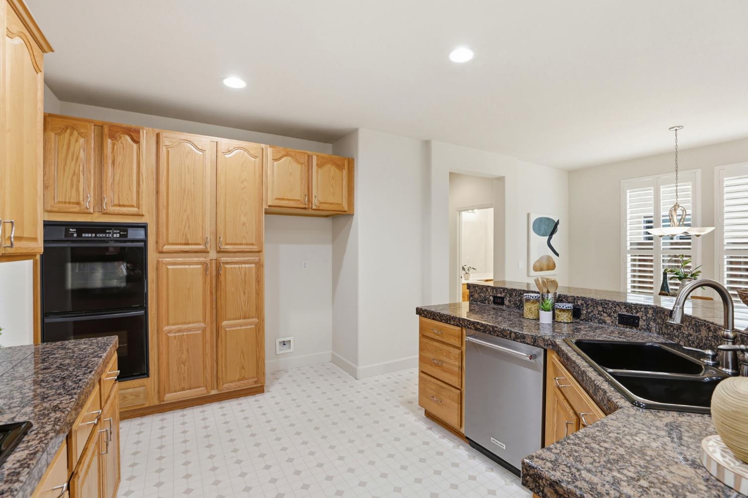 2624 West Pintail Way Elk Grove, CA 95757 - Photo 11 of 65 a kitchen with stainless steel appliances granite countertop a stove a sink and a refrigerator