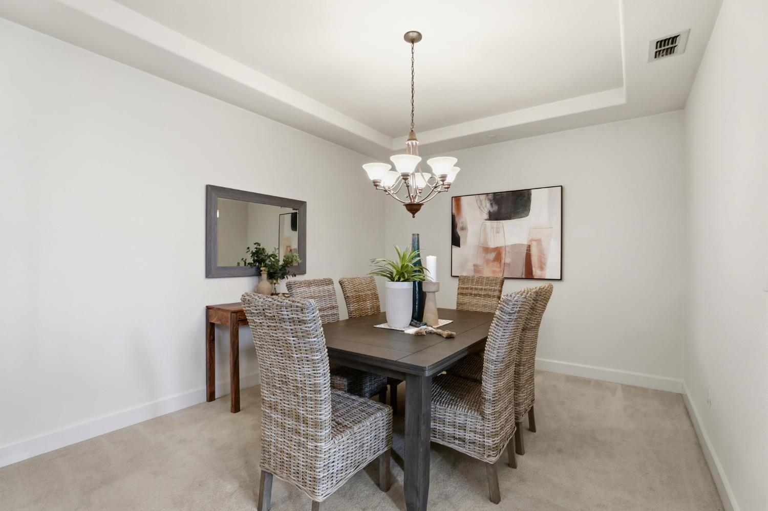 2624 West Pintail Way Elk Grove, CA 95757 - Photo 12 of 65 a dining room with furniture and chandelier