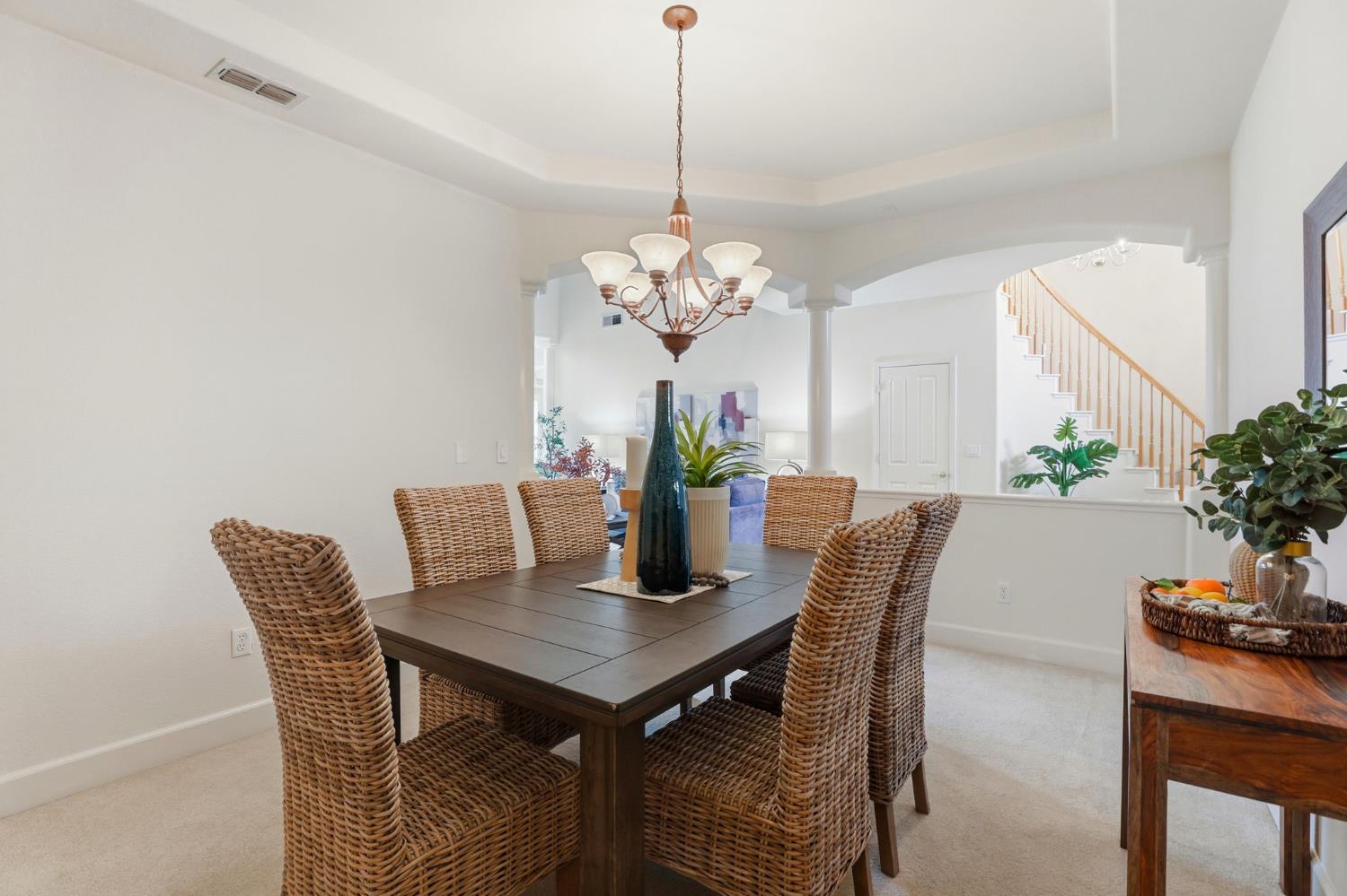2624 West Pintail Way Elk Grove, CA 95757 - Photo 13 of 65 a dining room with furniture and potted plant