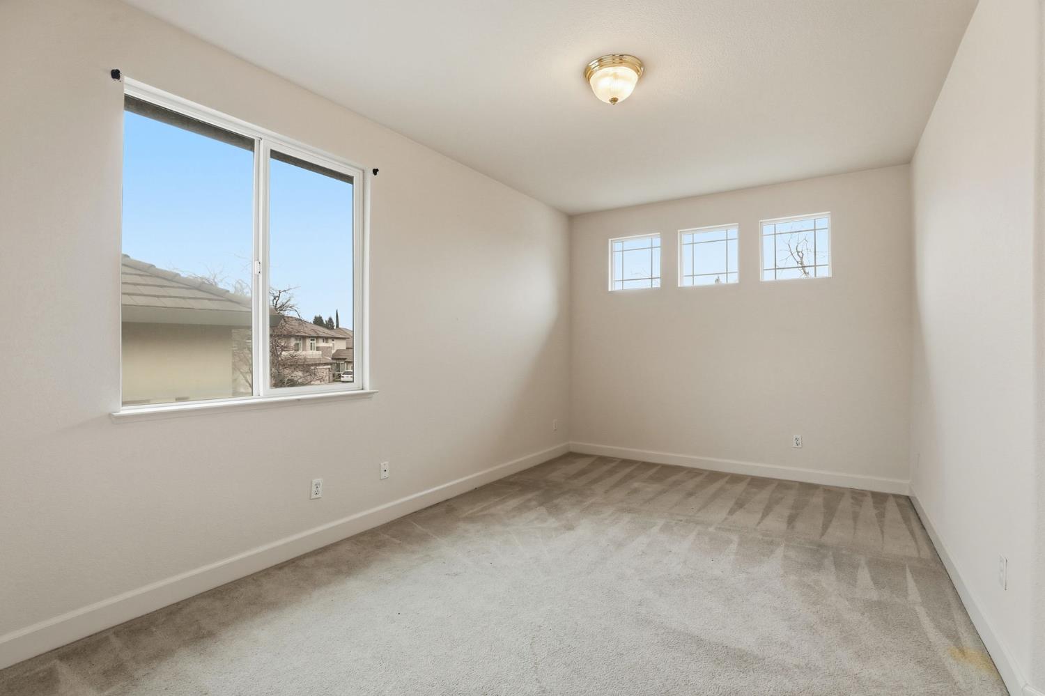 2624 West Pintail Way Elk Grove, CA 95757 - Photo 19 of 65 an empty room with a window