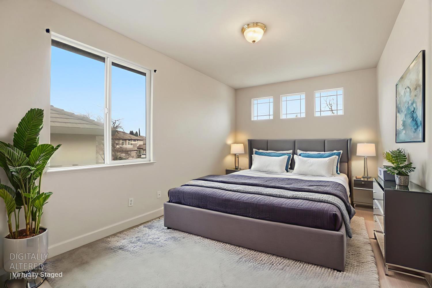 2624 West Pintail Way Elk Grove, CA 95757 - Photo 20 of 65 a bedroom with a large bed and a potted plant