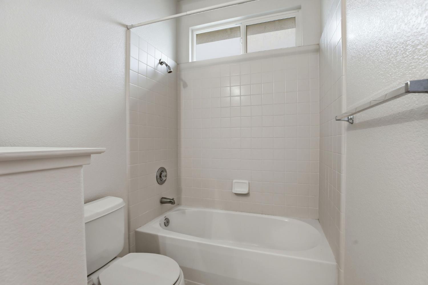 2624 West Pintail Way Elk Grove, CA 95757 - Photo 39 of 65 a white bath tub sitting next to a white toilet
