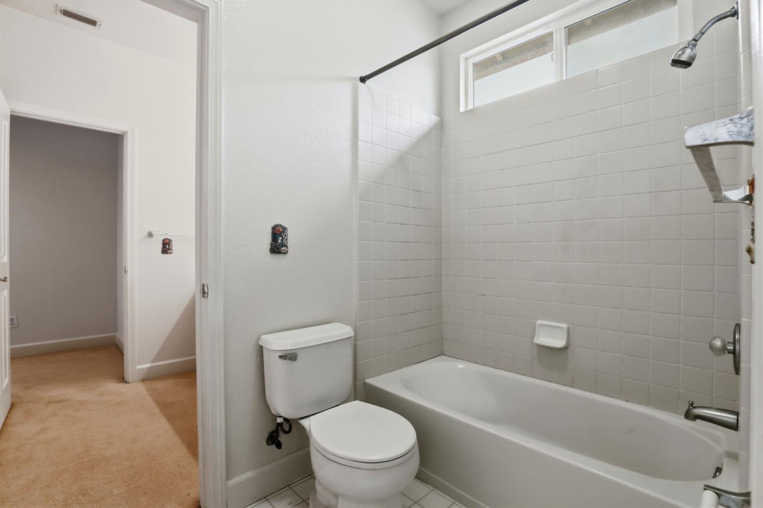 2624 West Pintail Way Elk Grove, CA 95757 - Photo 41 of 65 a bathroom with a toilet and a bath tub