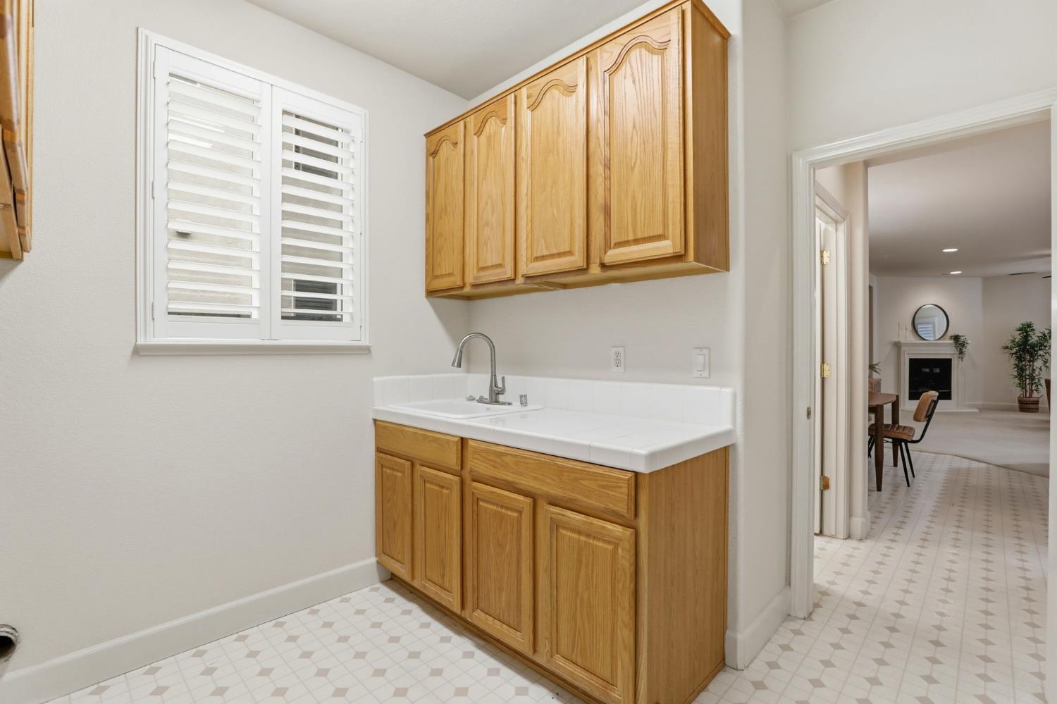 2624 West Pintail Way Elk Grove, CA 95757 - Photo 43 of 65 a kitchen with a sink cabinets and a window