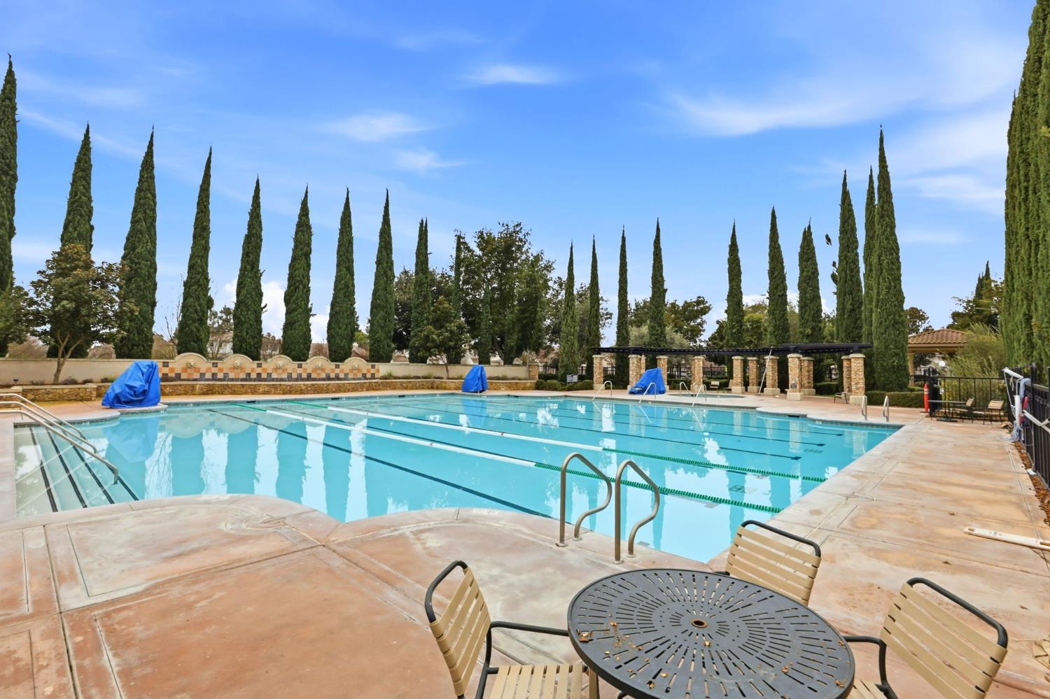 2624 West Pintail Way Elk Grove, CA 95757 - Photo 55 of 65 a view of a swimming pool with chairs