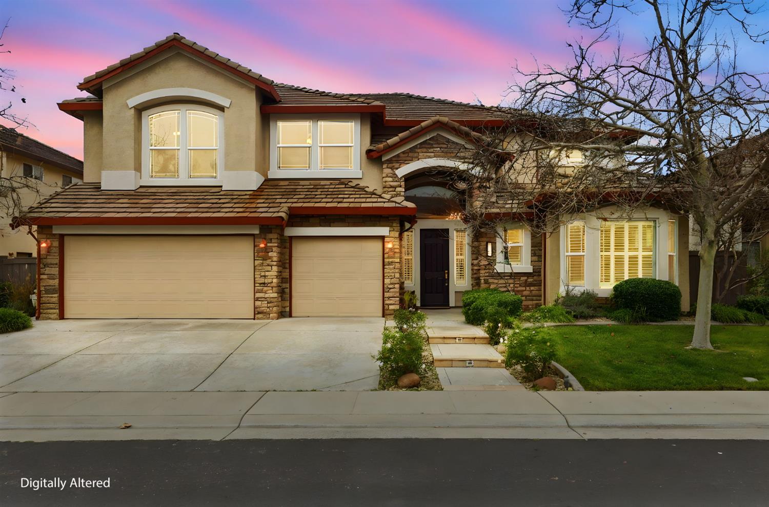 2624 West Pintail Way Elk Grove, CA 95757 - Photo 56 of 65 a front view of a house with a yard and garage