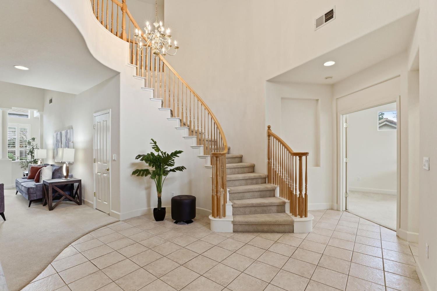 2624 West Pintail Way Elk Grove, CA 95757 - Photo 61 of 65 a living room with furniture and a chandelier