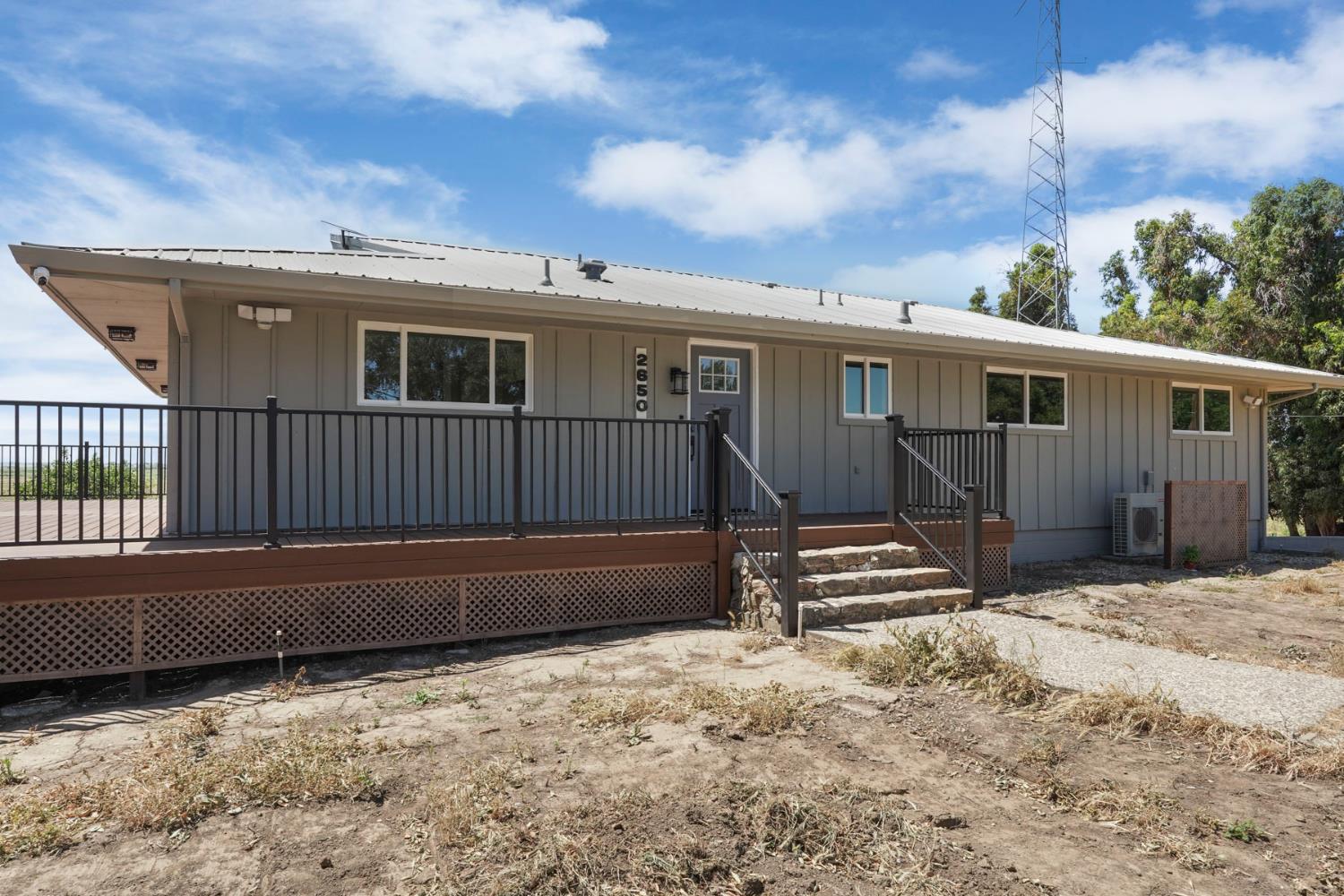 2650 West Twitchell Island Road Rio Vista, CA 94571 - Photo 4 of 60 a view of a house with a wooden roof and wooden fence