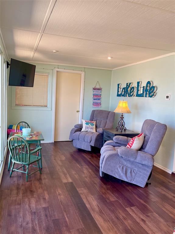 2334 San Bar Road, Unit 50 Graford, TX 76449 - Photo 11 of 40 a living room with furniture and a wooden floor