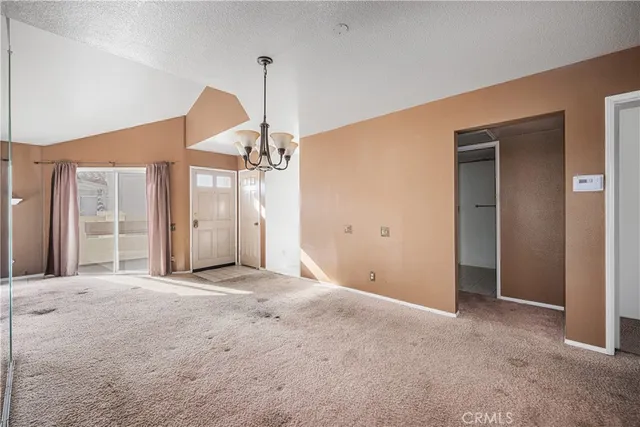 a kitchen with a stove and a refrigerator