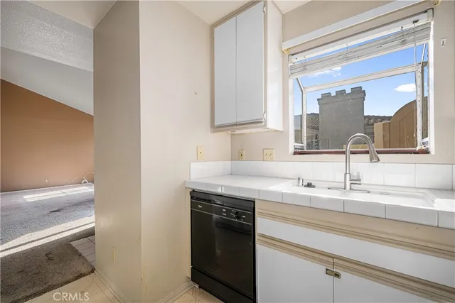 a kitchen with a sink and cabinets