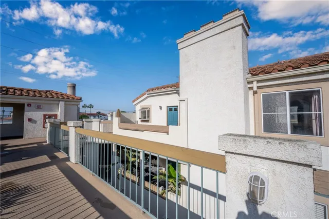 a view of a balcony with furniture