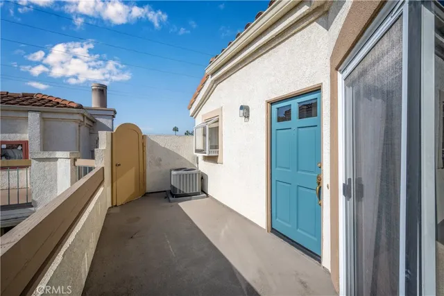 a view of a hallway with a chandelier