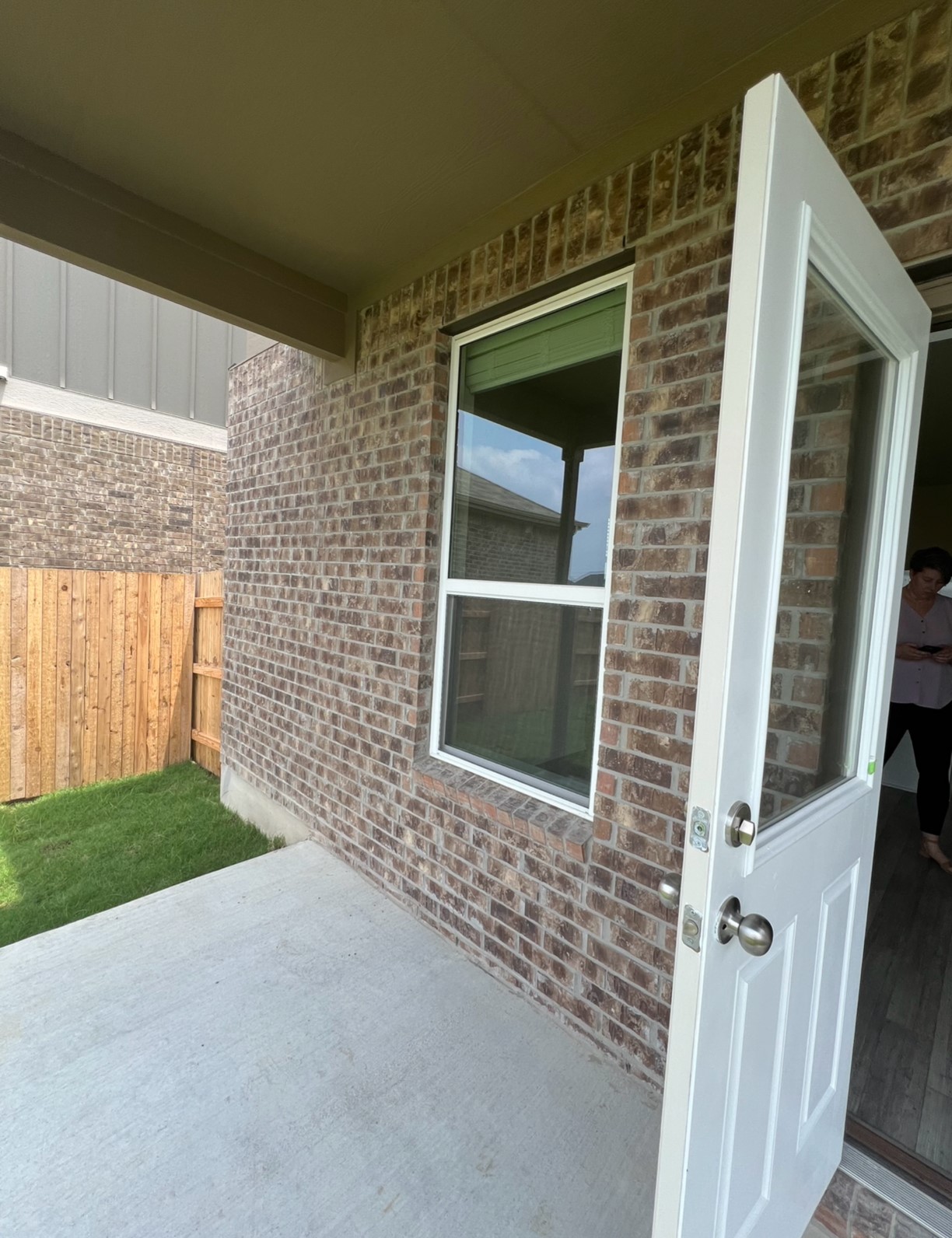 499 Tree Nut Loop Buda, TX 78610 - Photo 28 of 33 Brick exterior and covered patio