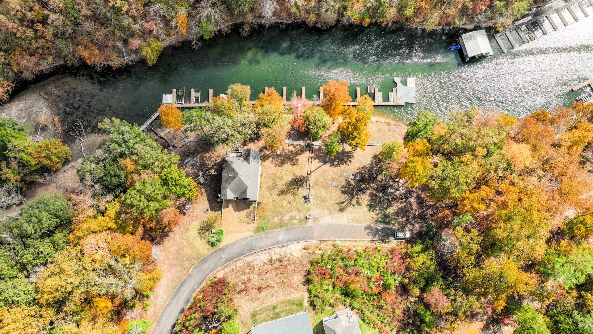 123 Breeze Point Savannah, TN 38372 - Photo 15 of 32 a view of a lake with a yard and large trees