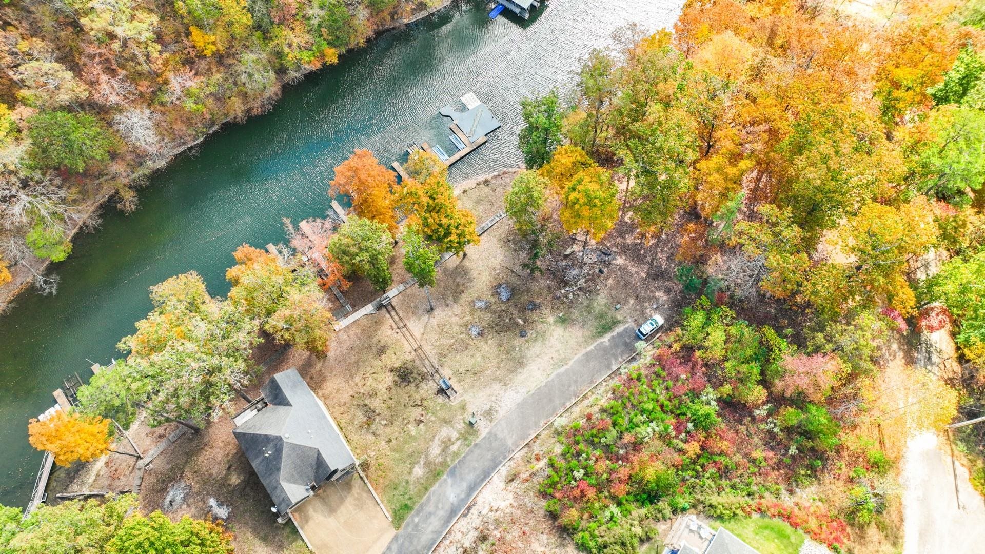 123 Breeze Point Savannah, TN 38372 - Photo 18 of 32 a view of a lake with a yard