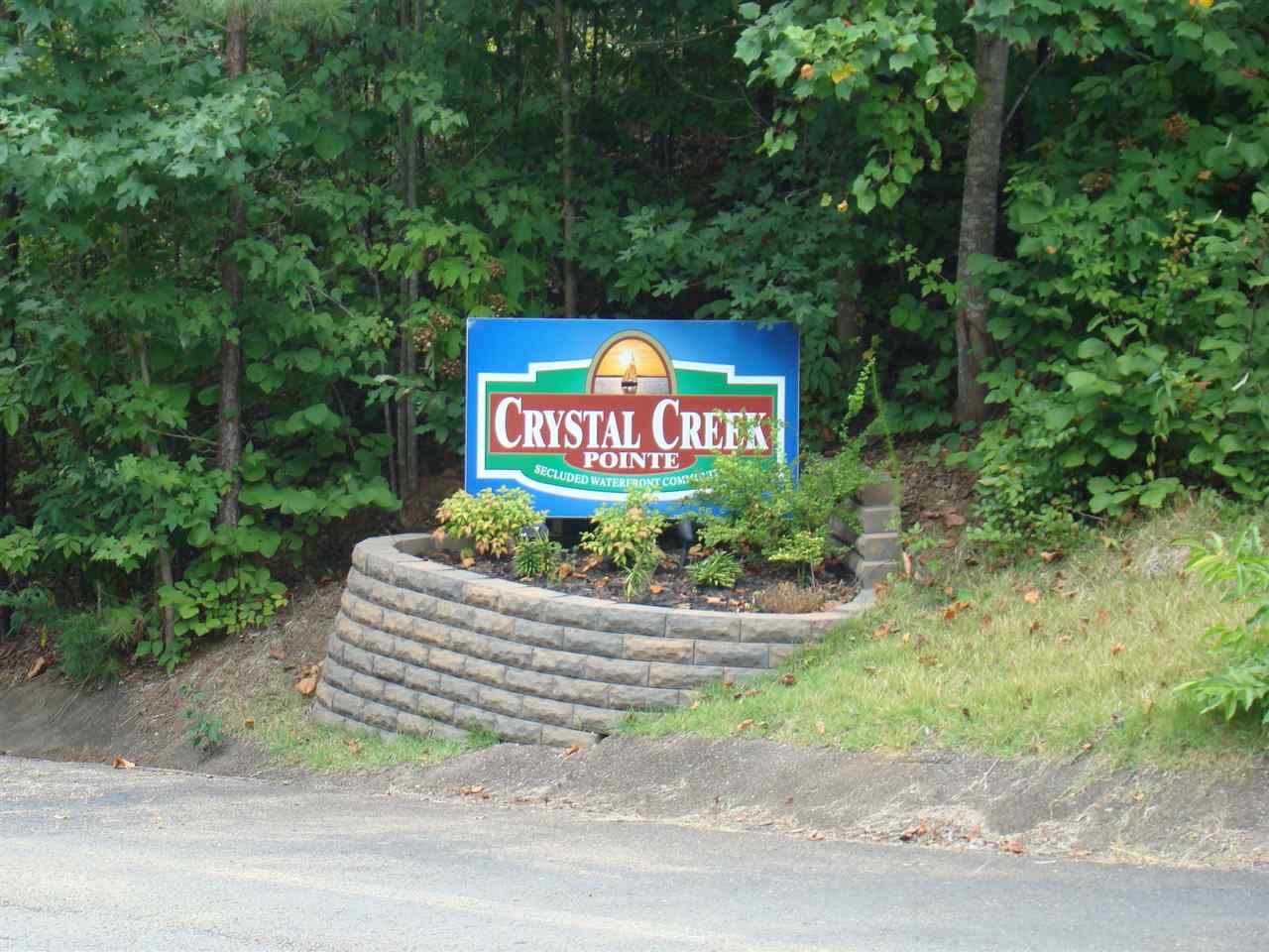 123 Breeze Point Savannah, TN 38372 - Photo 2 of 32 a sign that is sitting on a side of a road