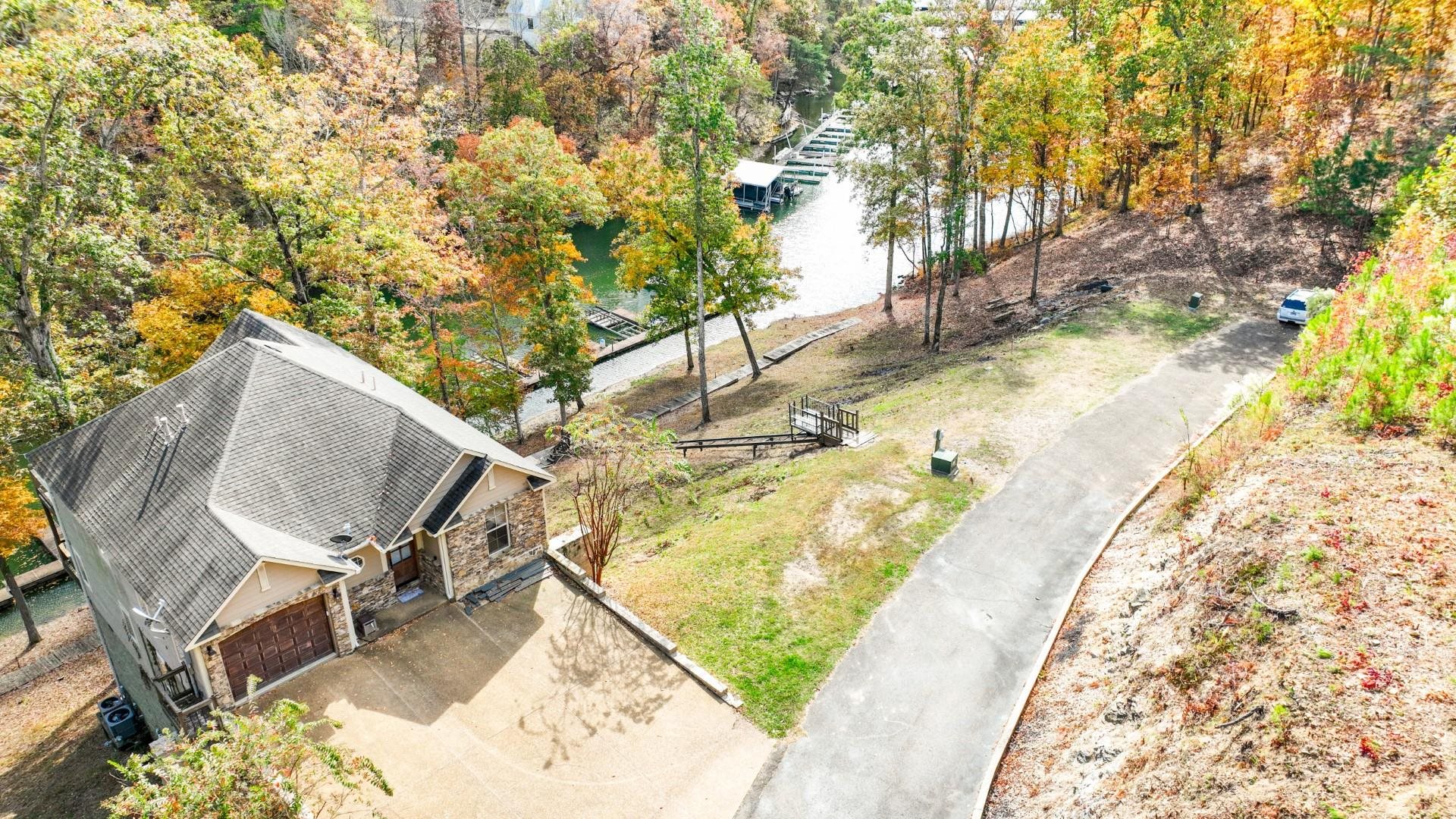 123 Breeze Point Savannah, TN 38372 - Photo 21 of 32 a view of a swimming pool with lounge chair