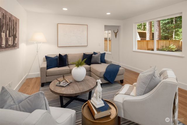 a living room with furniture and a window