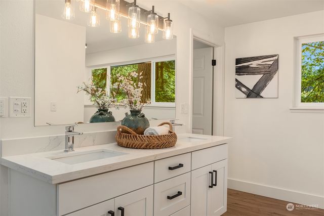 a bathroom with a sink and a window
