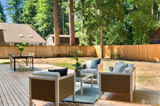 a view of swimming pool with an outdoor seating