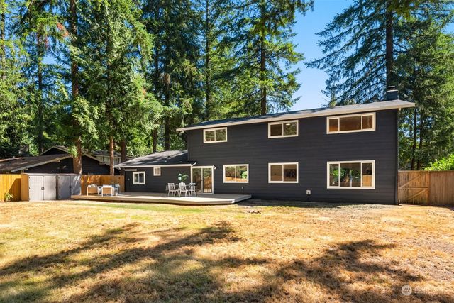 a front view of a house with parking space