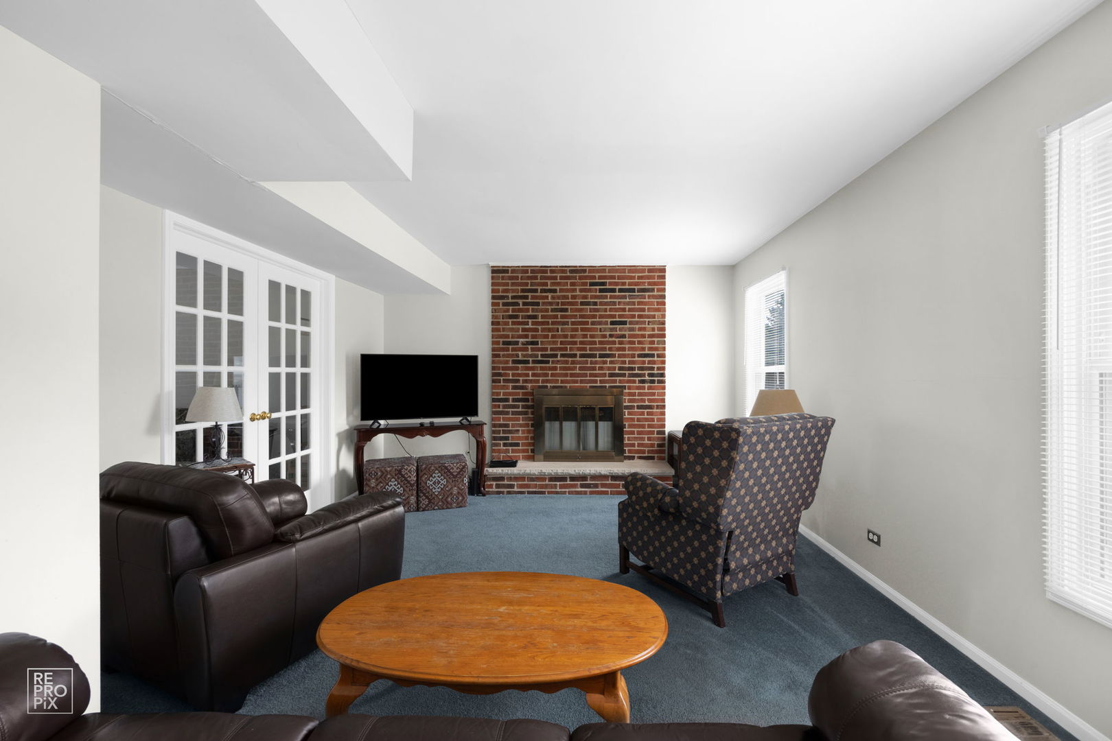 720 Small Court Naperville, IL 60563 - Photo 12 of 25 a living room with furniture and a flat screen tv