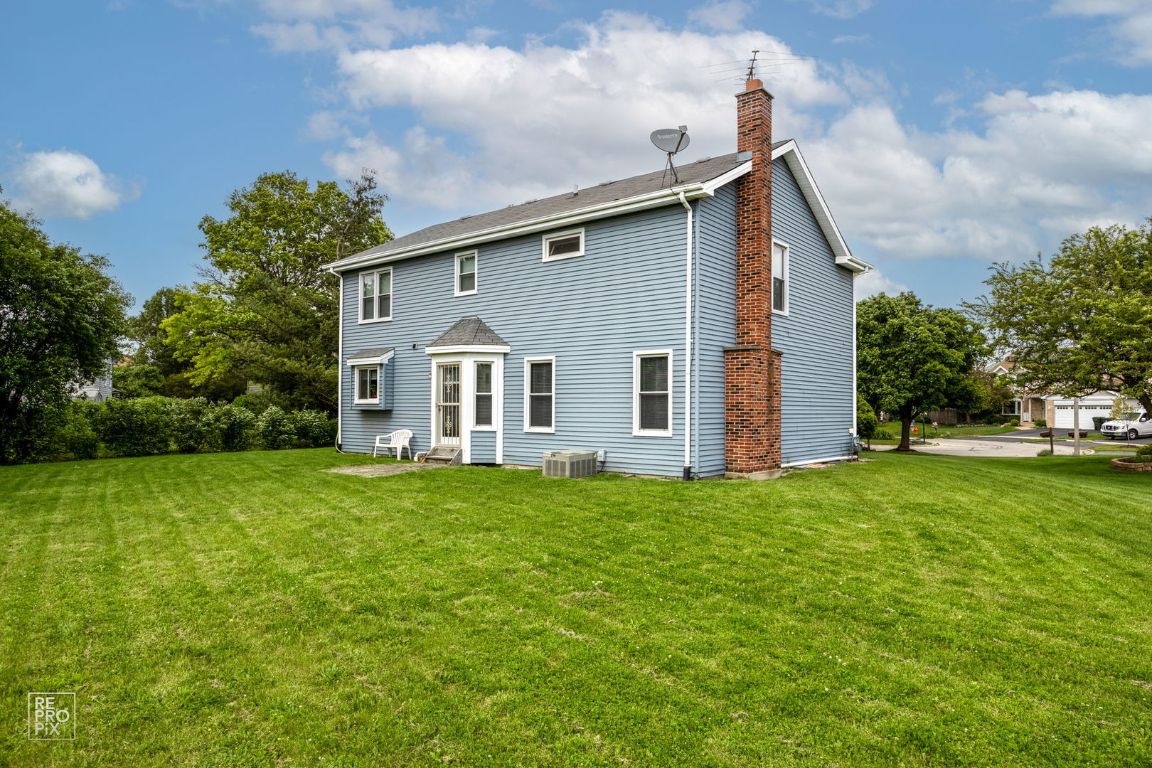 720 Small Court Naperville, IL 60563 - Photo 25 of 25 a view of a house with backyard and garden