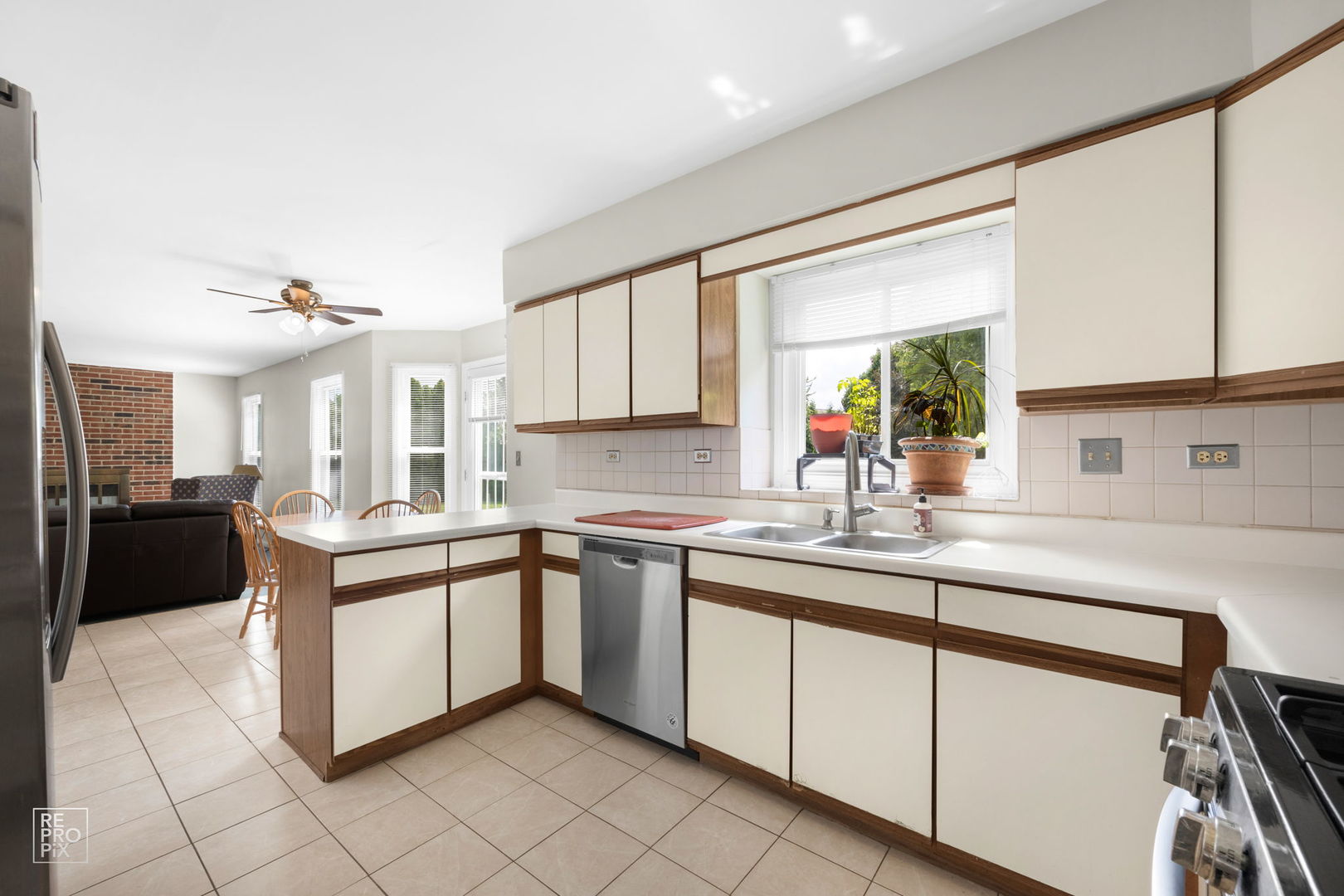 720 Small Court Naperville, IL 60563 - Photo 4 of 25 a kitchen with stainless steel appliances granite countertop a sink and cabinets