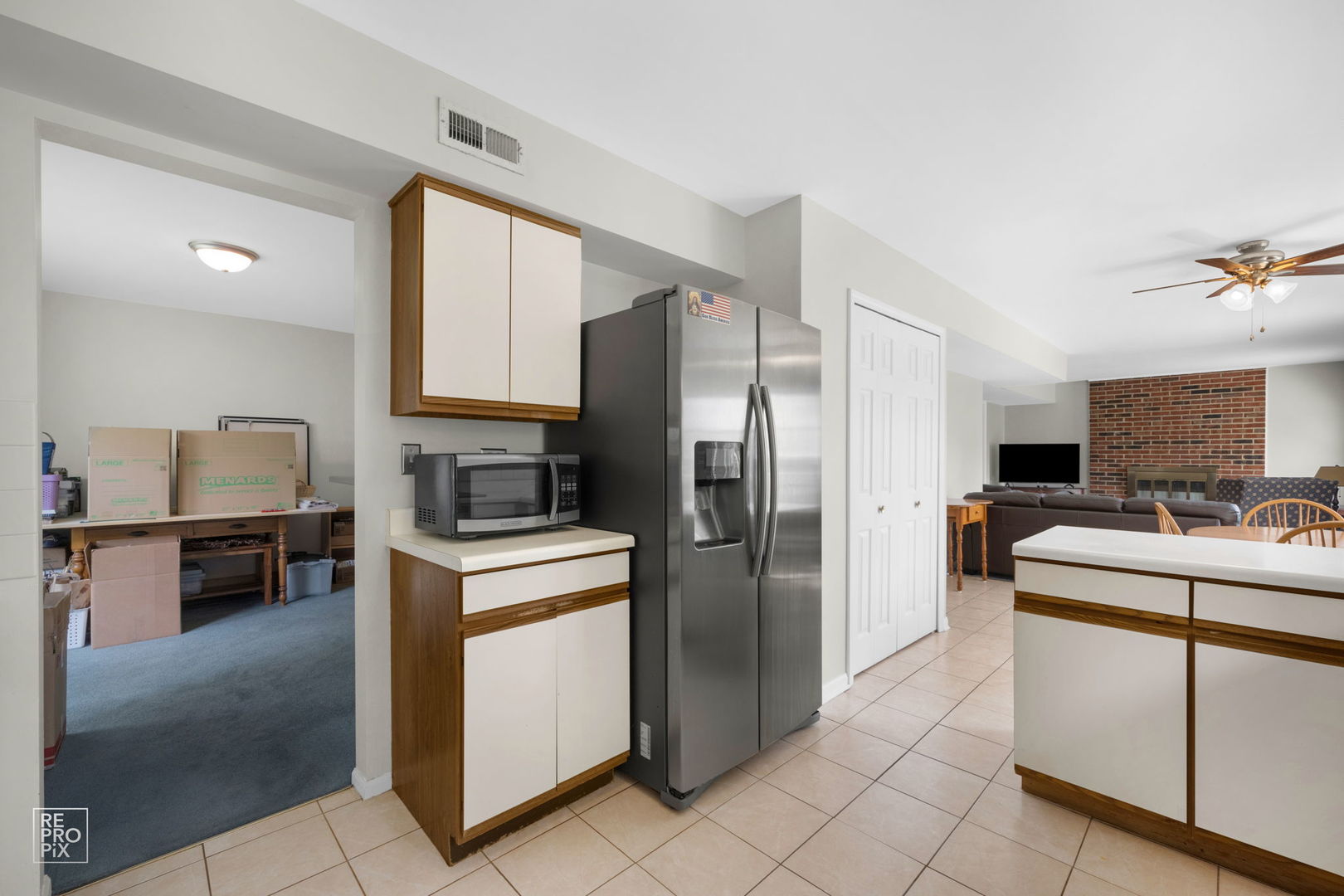 720 Small Court Naperville, IL 60563 - Photo 7 of 25 a kitchen with a sink cabinets and stainless steel appliances