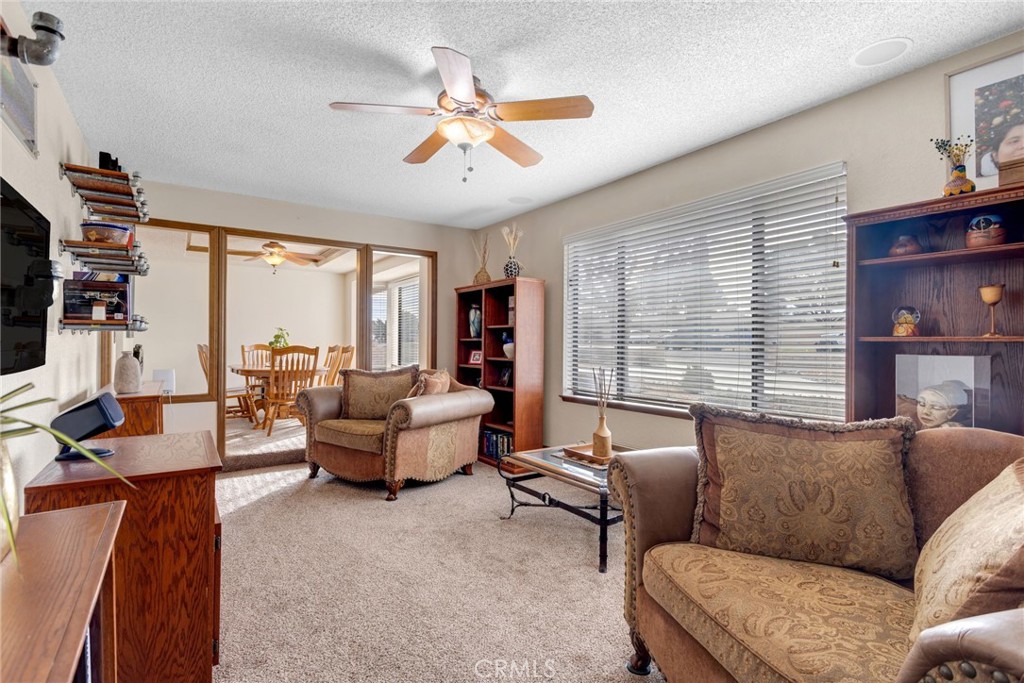 20360 Ituma Road Apple Valley, CA 92308 - Photo 11 of 66 a living room with furniture and a large window