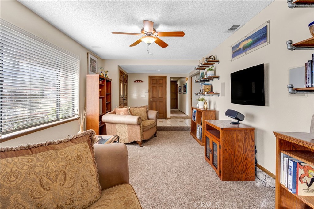 20360 Ituma Road Apple Valley, CA 92308 - Photo 12 of 66 a living room with furniture and a flat screen tv