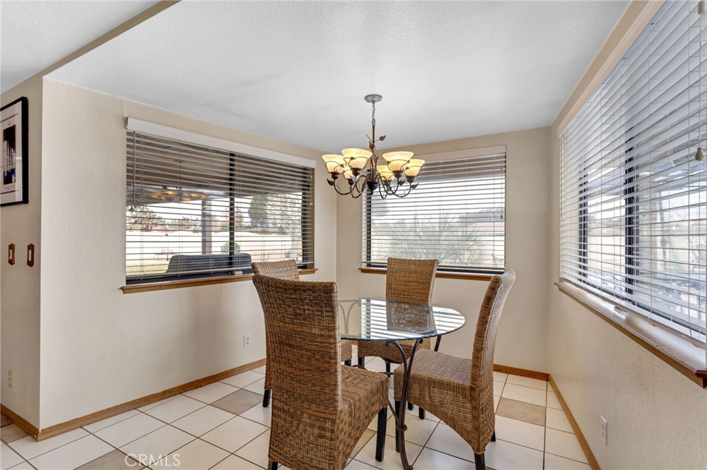 20360 Ituma Road Apple Valley, CA 92308 - Photo 17 of 66 a dining room with furniture and window