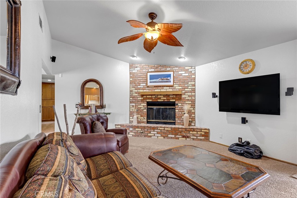 20360 Ituma Road Apple Valley, CA 92308 - Photo 21 of 66 a living room with furniture and a flat screen tv