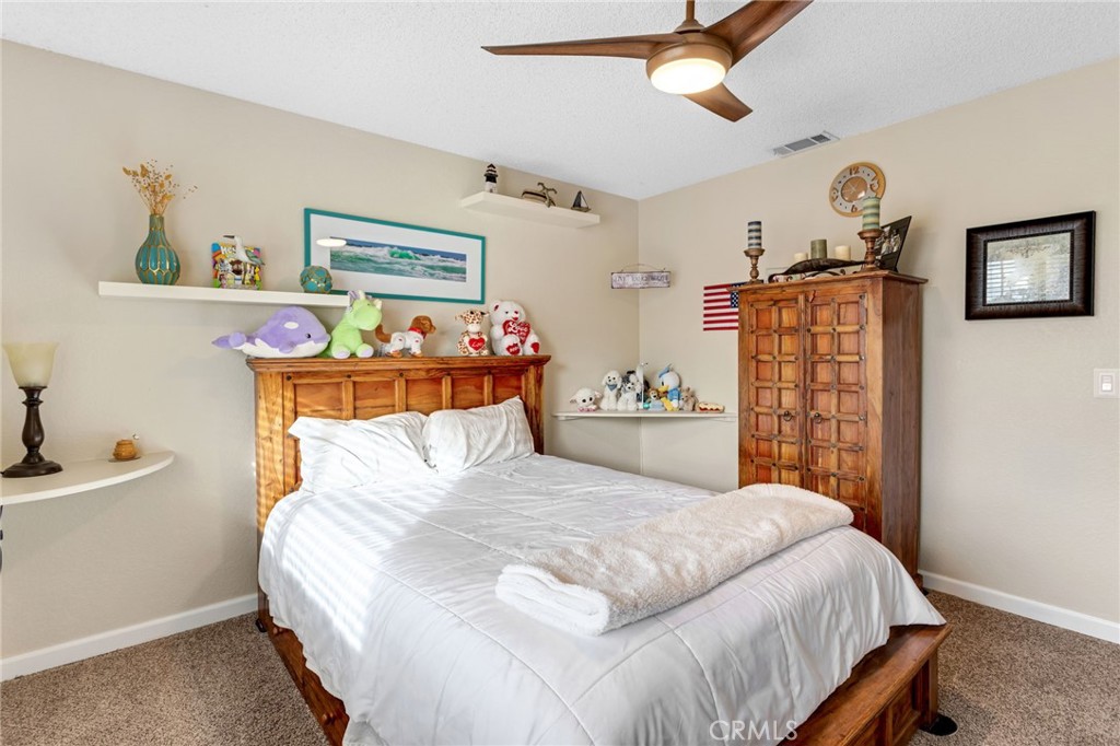 20360 Ituma Road Apple Valley, CA 92308 - Photo 25 of 66 a bedroom with a bed and a window