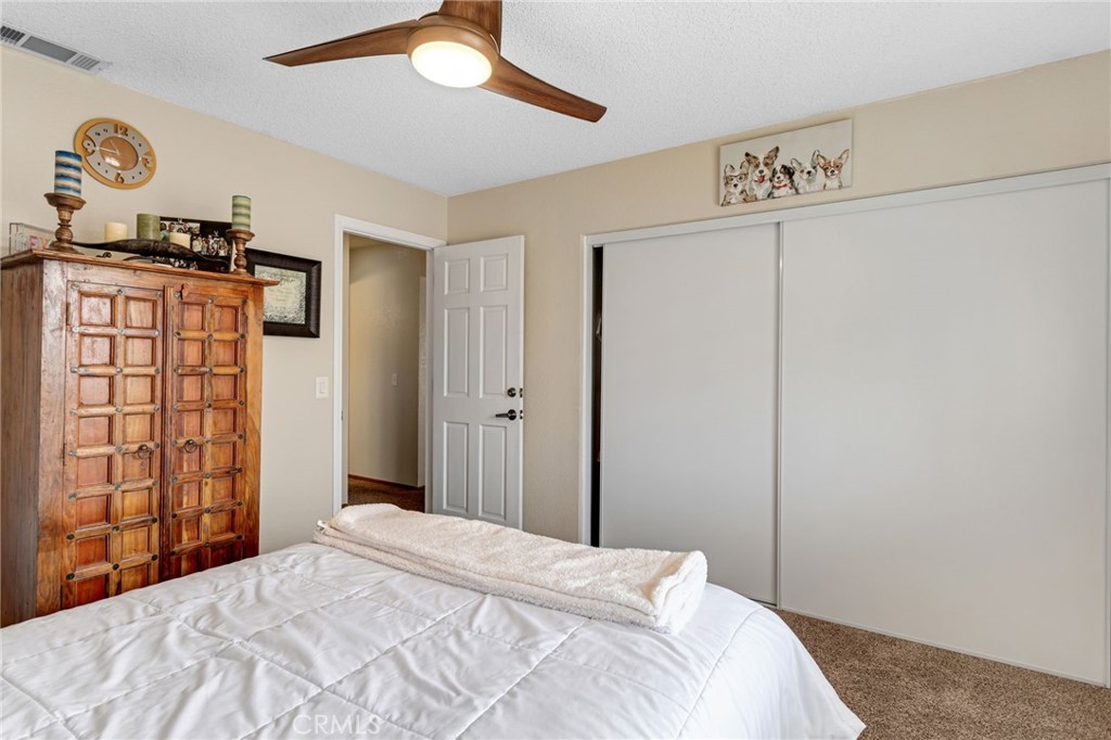 20360 Ituma Road Apple Valley, CA 92308 - Photo 26 of 66 a bedroom with a bed and a window